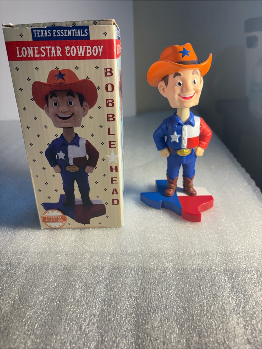 Essentials Lonestar Cowboy Bobblehead - Orange Hat, Blue & Red Outfit